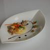 Kartoffel-Schweinshaxl-Ravioli mit jungem Spinat und Eierschwämme Sauce