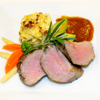 Rosa gebratenes Schweinefilet mit Polenta-Tomaten-Auflauf und buntem Gemüse von Horst Sommerer