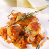 Pouletschenkel an einer Speck-Peperoni-Sauce
