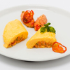 Mit Tomaten gefülltes Reisomelette